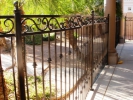 3-rail curved pool fence with scrolls and ball tops